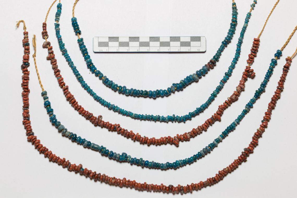 Several ancient necklaces made of blue and red glass beads found at Frattesina.