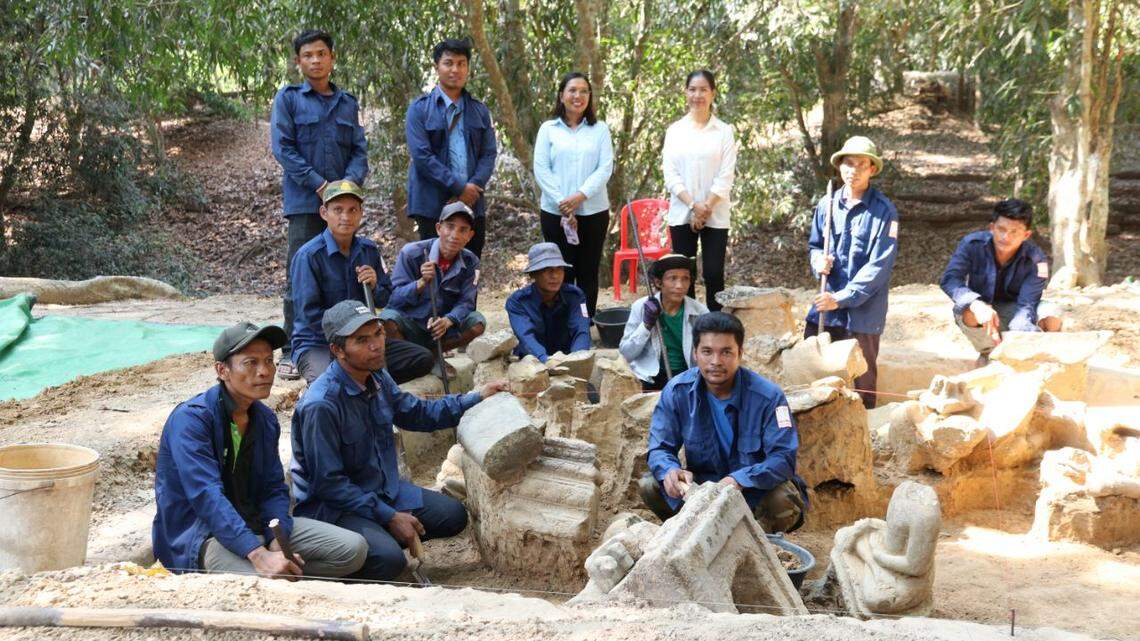 Archaeologists unearthed dozens of ancient stone artifacts while cleaning up dirt at an 800-year-old temple in Cambodia, photos show.