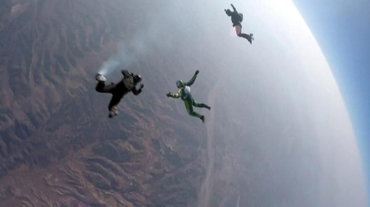 FILE PHOTO: In this stock image, Luke Aikins, center, skydives without a parachute over Simi Valley, Calif., Saturday, July 30, 2016.