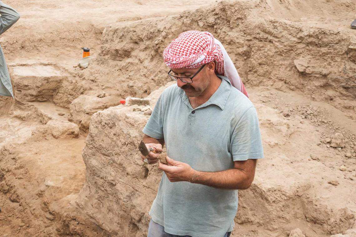 An archaeologist excavates the ancient ruins at Tava Tepe.