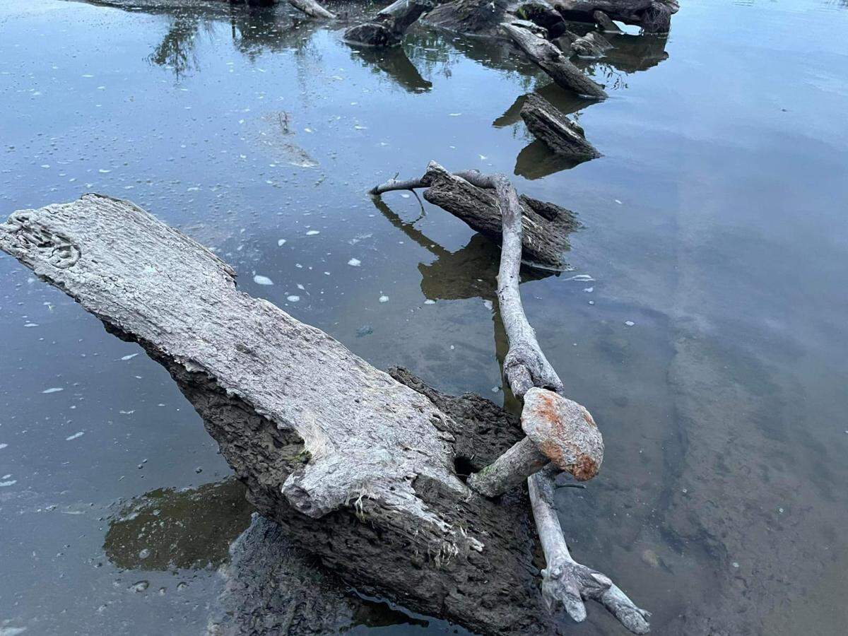 The 350-year-old ship still partially submerged in the river.