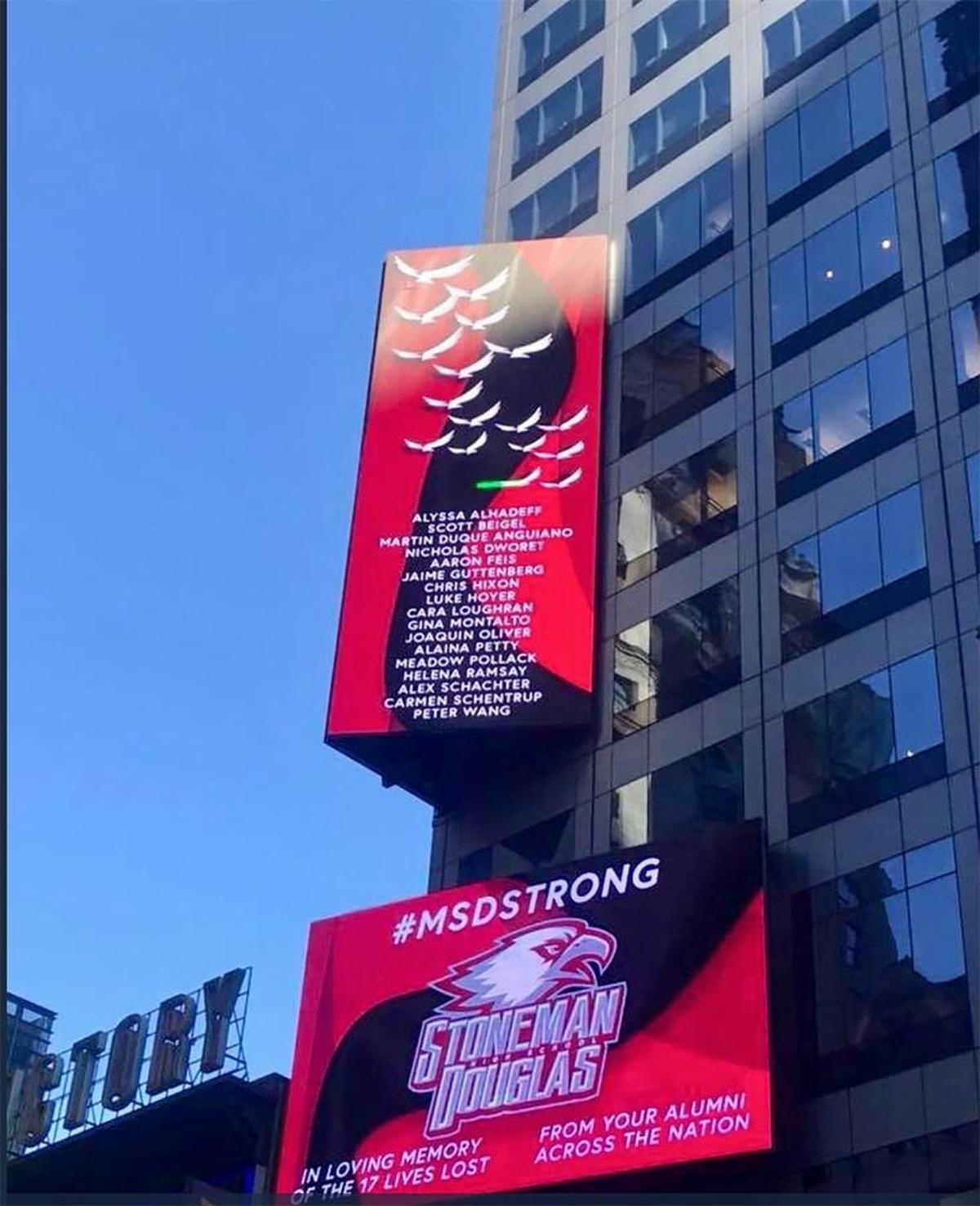 Signs adorn a Times Square building on March 6, 2018, in memory of the 17 Marjory Stoneman High School victims.