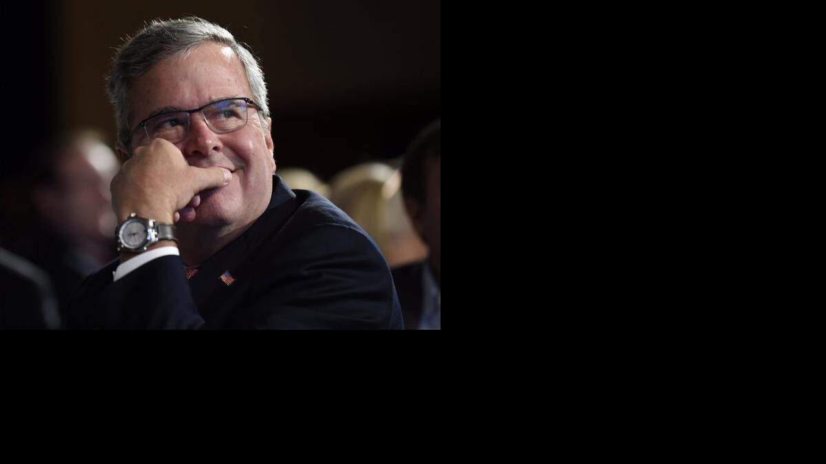 
Former Florida Gov. Jeb Bush listens to a speaker before giving his keynote address at the National Summit on Education Reform in Washington, Thursday, Nov. 20, 2014. (AP Photo/Susan Walsh)
