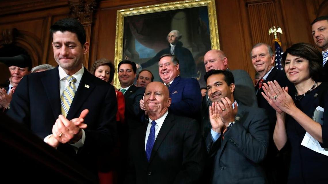 House Speaker Paul Ryan of Wis., left, leads applause for House Ways and Means Chair Rep. Kevin Brady, R-Texas, along with Rep. Carlos Curbelo, R-Fla., and Rep. Cathy McMorris Rodgers, R-Wash., during a news conference following a vote on tax reform on Capitol Hill in Washington, Thursday, Nov. 16, 2017. Republicans passed a near $1.5 trillion package overhauling corporate and personal taxes through the House, edging President Donald Trump and the GOP toward their first big legislative triumph in a year in which they and their voters expected much more.