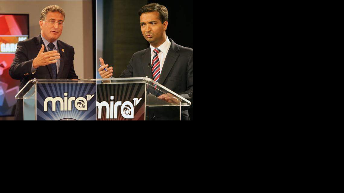
U.S. Rep. Joe Garcia, left, and challenger Carlos Curbelo, right, pictured at a debate this month.
