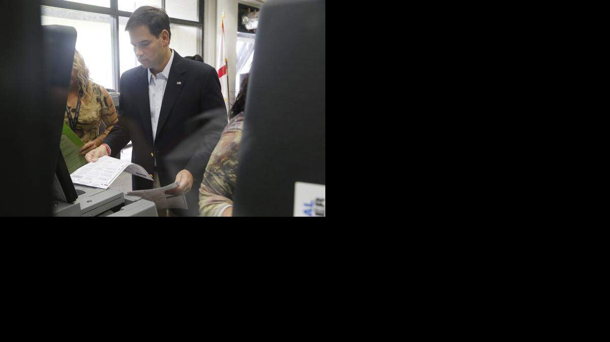 
Sen. Marco Rubio casts his ballot at the West Dade Regional Library in Miami during the first day of early voting in October.
