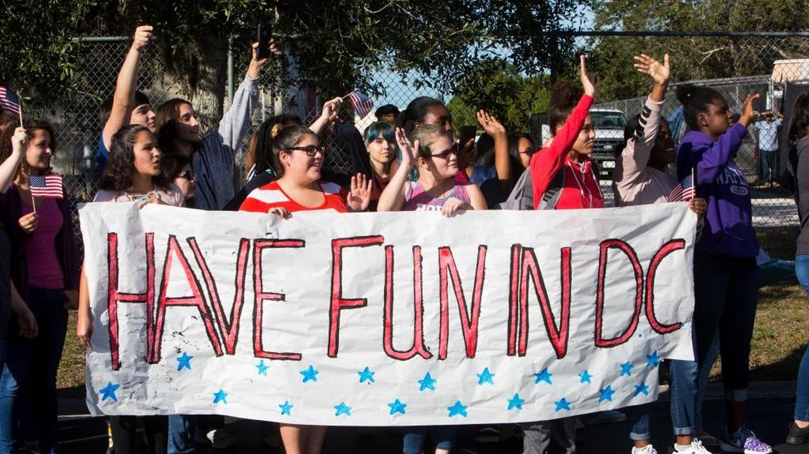 Students in Naples wave goodbye Wednesday to the Palmetto Ridge High School marching band, which will perform at the inaugural parade for President-elect Donald Trump.