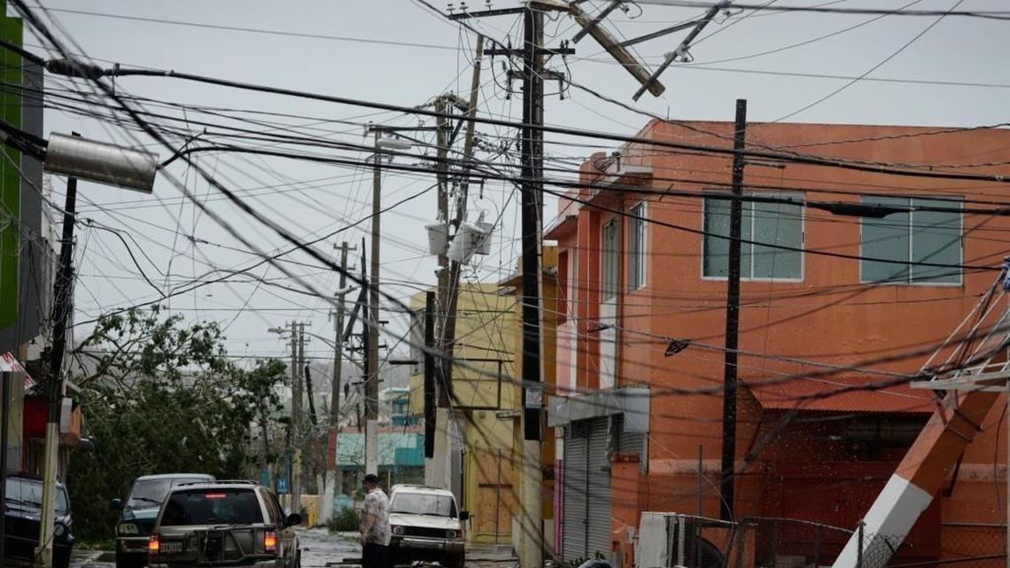 In this Sept. 20, 2017, photo, power lines are down in Puerto Rico after Hurricane Maria hit the island.