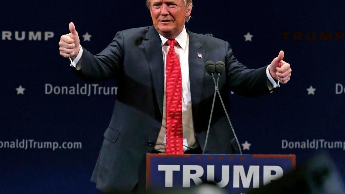 Republican presidential candidate Donald Trump flashes thumbs up after an address to a group of supporters at a campaign stop at the Flynn Center of the Performing Arts in Burlington, Vt., Thursday, Jan. 7, 2016.
