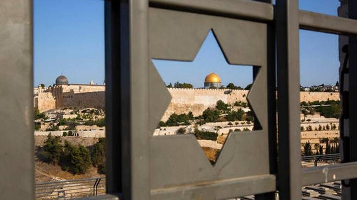 In this July 25, 2017, file photo, Jerusalem’s Old City is seen through a door with the shape of a star of David.