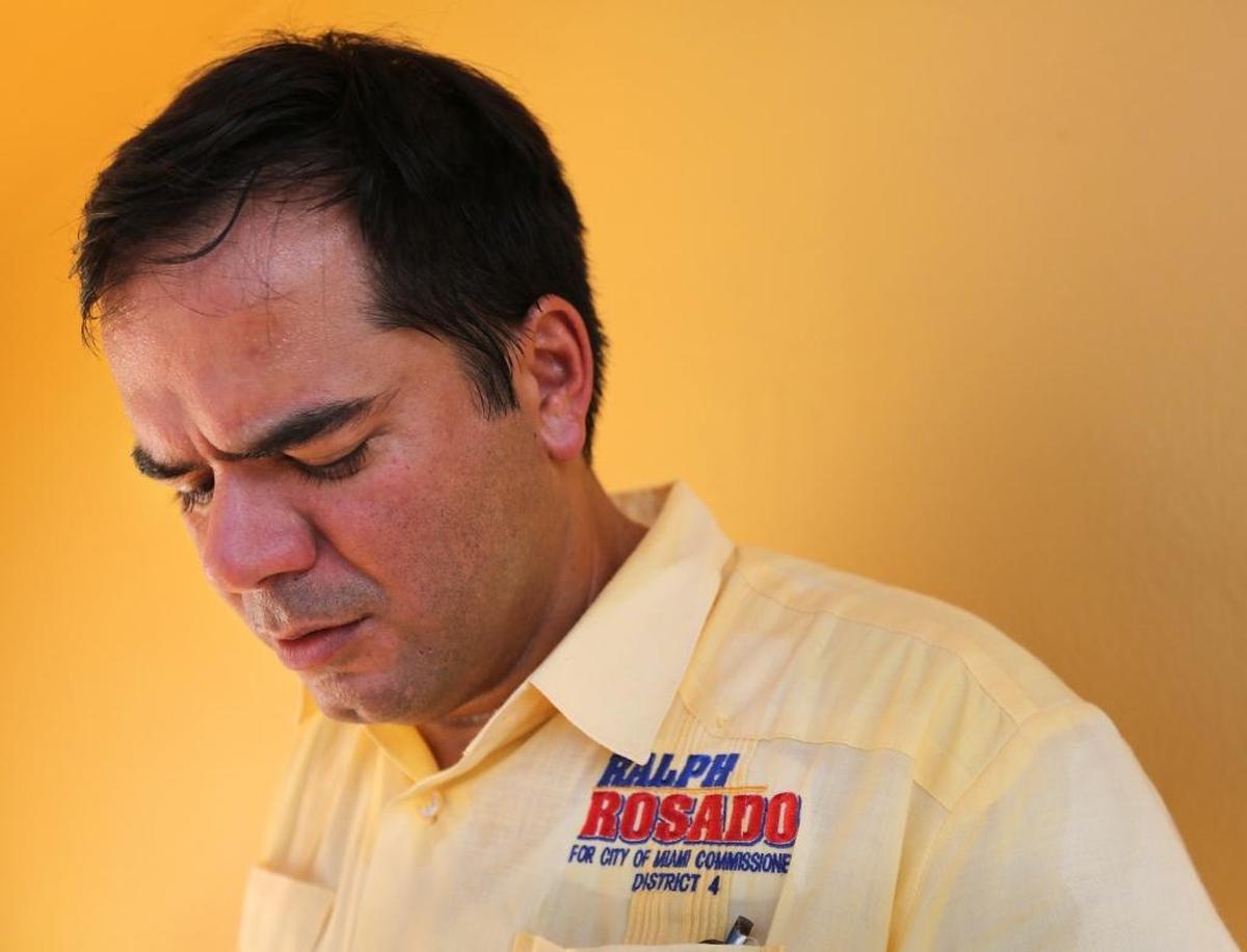 Ralph Rosado, a candidate for Miami’s District 4 commission seat, checks his list as he knocks on doors around the Magic City neighborhood.