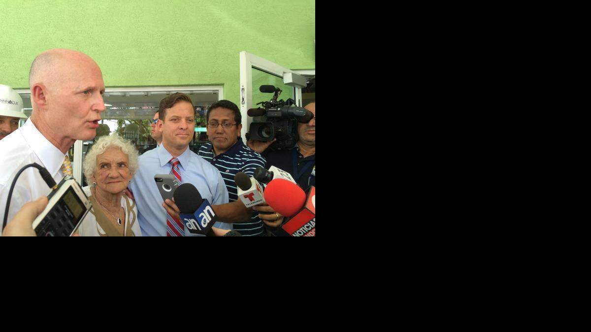 
Florida Gov. Rick Scott speaks to reporters outside Hialeah’s Casa Maiz restaurant Monday.
