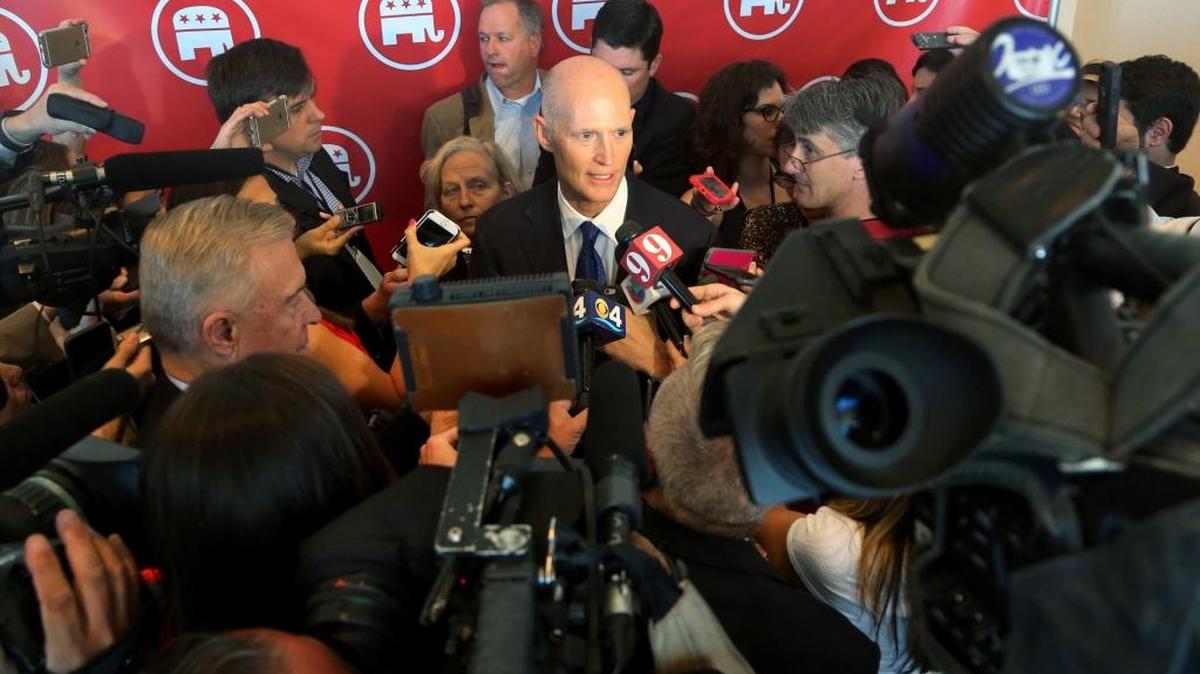 Florida Gov. Rick Scott speaks to the media after a Republican National Committee gathering at Diplomat Hotel in Hollywood in April.