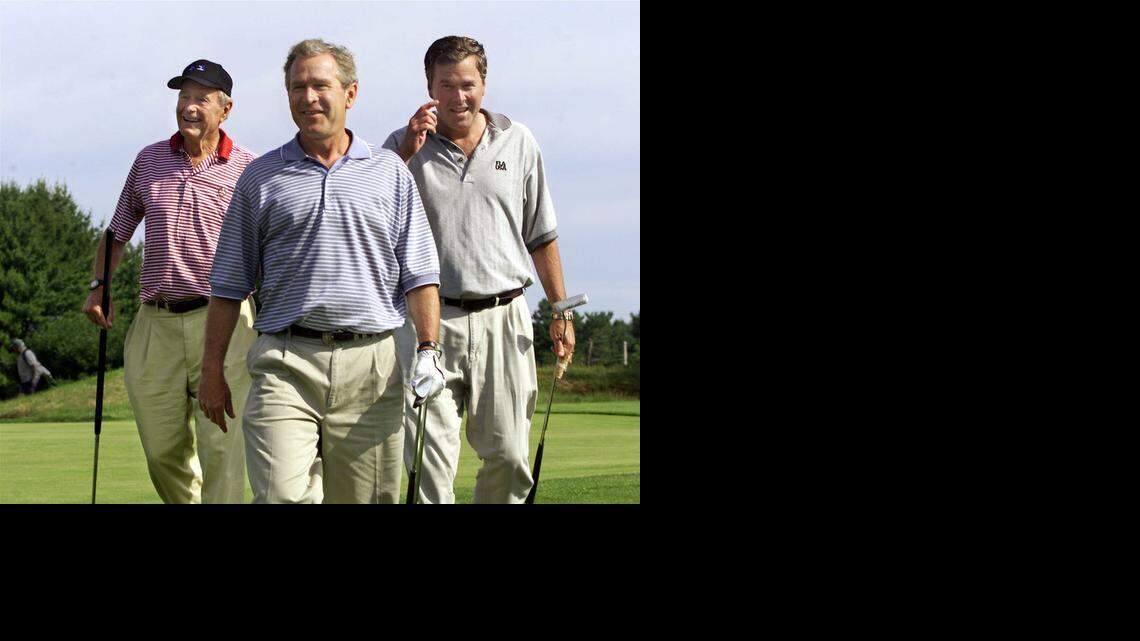 
In 2001, President Bush, center, walks off the 18th hole with his brother, then-governor Jeb Bush, right, and father, former President George H.W. Bush, left, at the Cape Arundel Golf Club in Kennebunkport, Maine, Saturday, July 7, 2001. The elder Bush is credited with putting a family priority on playing 18 holes quickly. 
