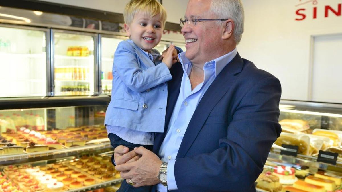 Carlos Beruff, a building contractor from Bradenton, went back to his Miami roots in announcing his run for the Senate at Vicky Bakery in Miami, Feb. 29, 2016. Beruff is holding his 2-year-old son.