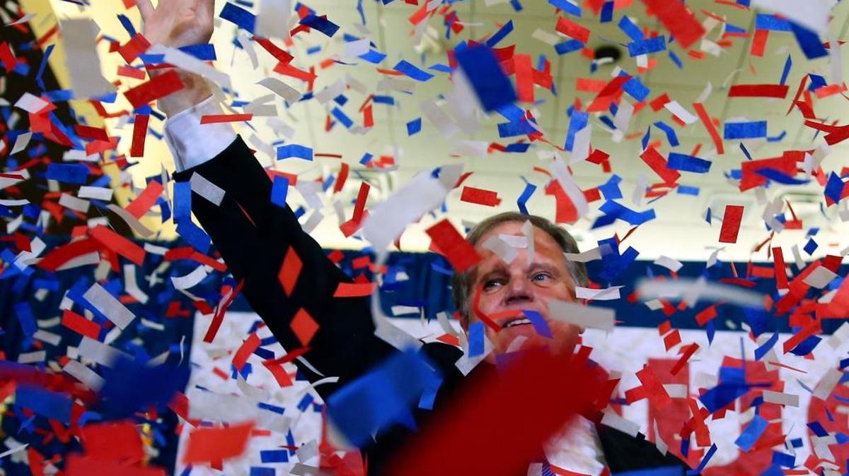 Democrat Doug Jones waves to supporters on Tuesday, Dec. 12, 2017, in Birmingham, Alabama. In a stunning victory aided by scandal, Jones won Alabama's special Senate election, beating back history, an embattled Republican opponent and President Donald Trump, who urgently endorsed GOP rebel Roy Moore despite a litany of sexual misconduct allegations.