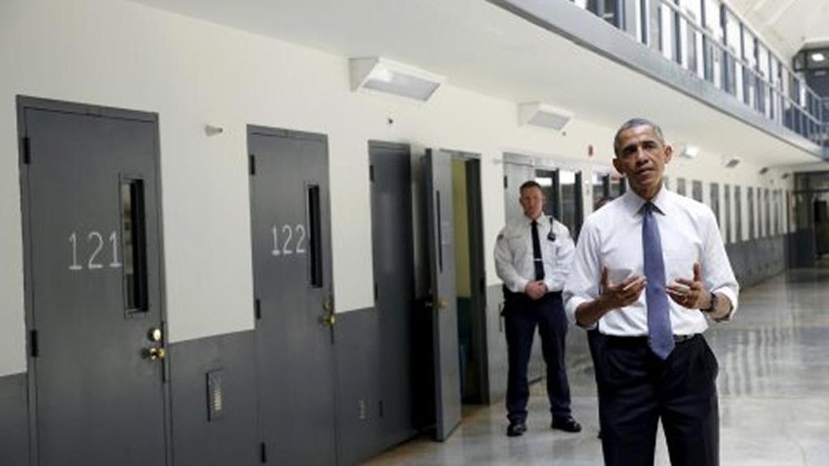 President Barack Obama pauses as he speaks at the El Reno Federal Correctional Institution in El Reno, Okla., July 16, 2015. Obama was the first sitting president to visit a federal prison.