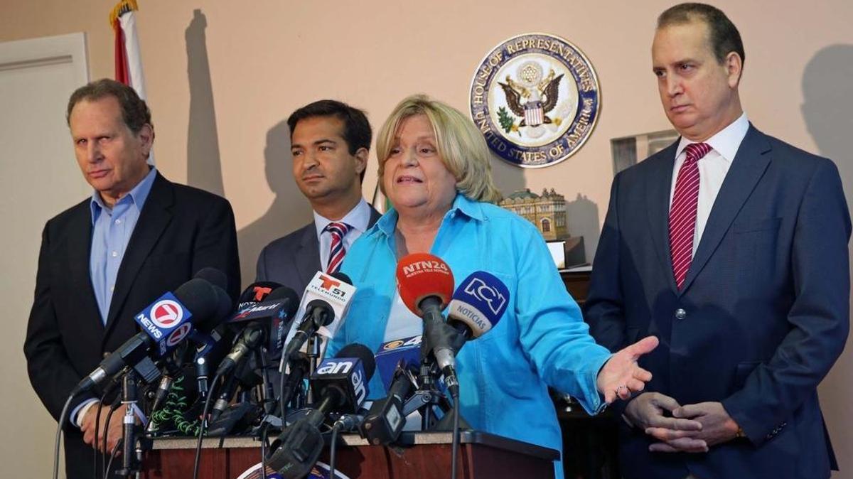 U.S. Reps. Ileana Ros-Lehtinen and Carlos Curbelo, standing at her immediate left, favored a short-lived move by House Republicans to gut the Office of Congressional Ethics. U.S. Rep. Mario Diaz-Balart, right, opposed it.