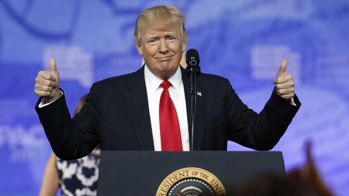 President Donald Trump gives thumbs up as he arrives to speak at the Conservative Political Action Conference on Friday in Oxon Hill, Maryland.
