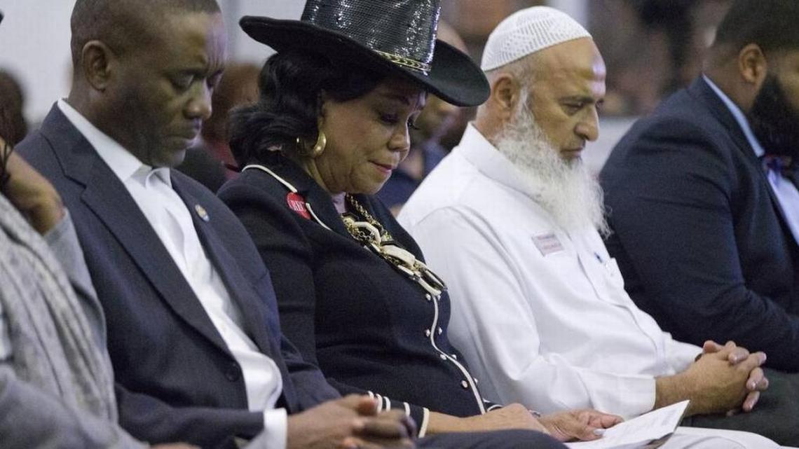 Democratic Rep. Frederica Wilson, center, is joined by Miami-Dade County Commissioner Jean Monestime, left, and businessman Abdul Razzak Khanani, right, during a prayer vigil before watching President Donald Trump's State of the Union speech at the Historic Greater Bethel AME Church on Tuesday, Jan. 30, 2018, in Miami.