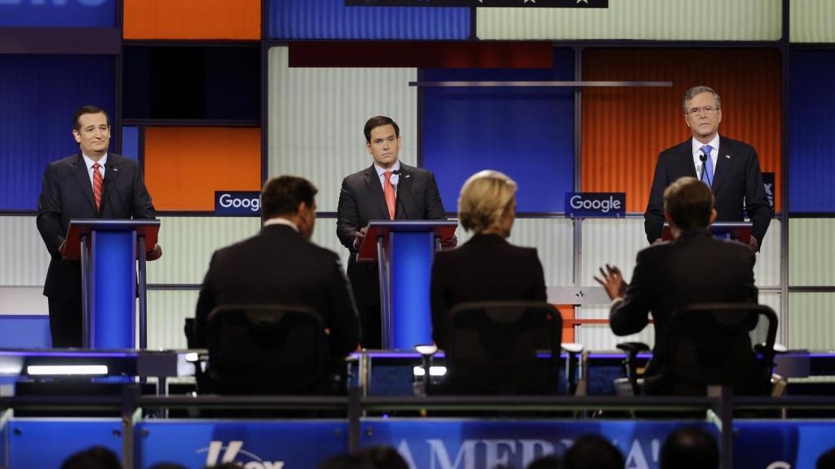 Ted Cruz, left, Marco Rubio and Jeb Bush listen to a question from moderator Chris Wallace during a Republican presidential primary debate, Thursday, Jan. 28, 2016, in Des Moines, Iowa.