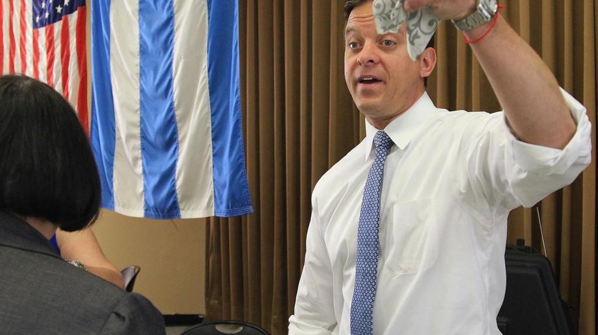 Lt. Gov. Carlos Lopez-Cantera raises his cafecito as he campaigns at inside the Allapattah Community Action Center on Tuesday, April 26, 2016.