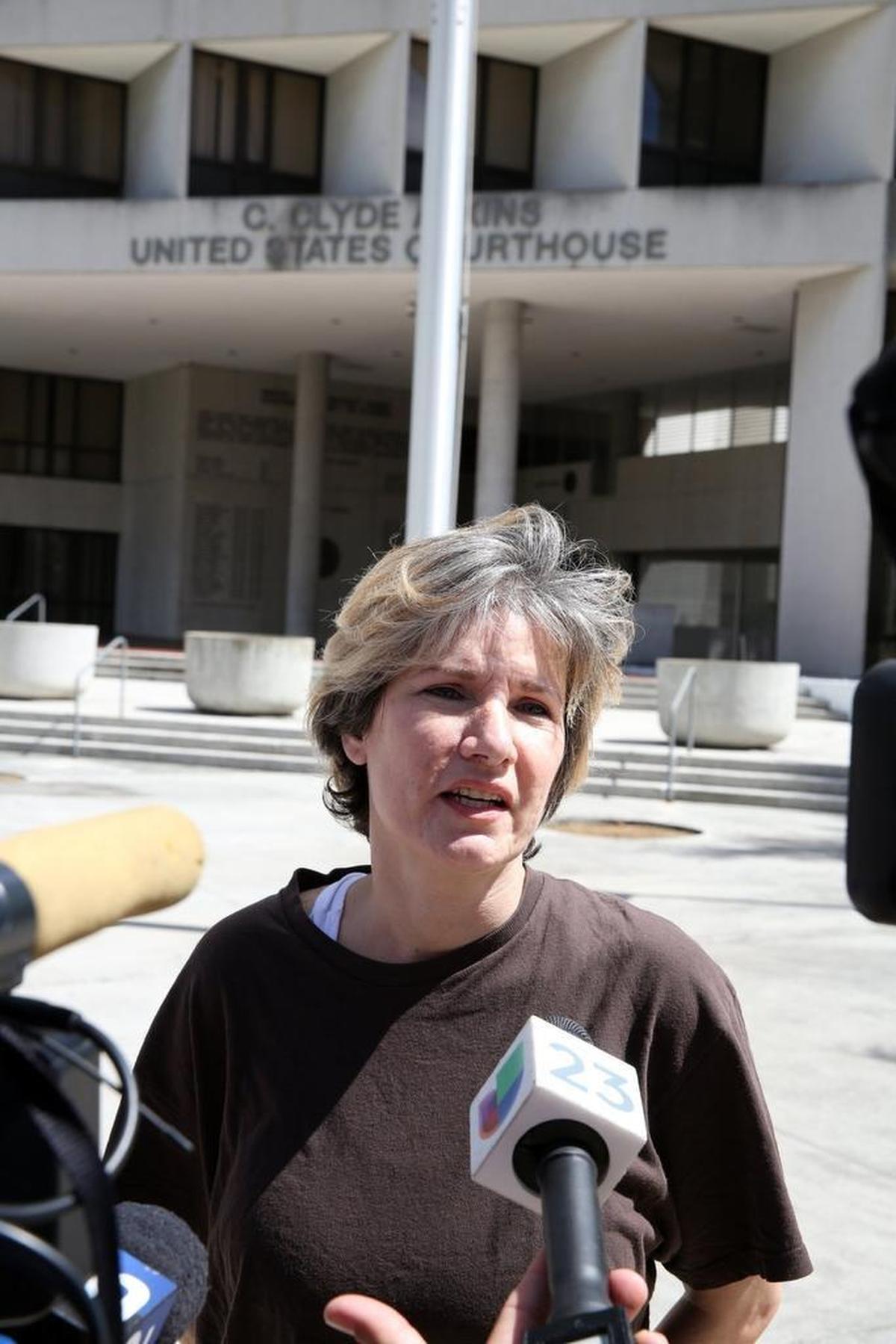 Ana Alliegro speaks with the media outside of Miami federal court in 2014, after being released from prison.
