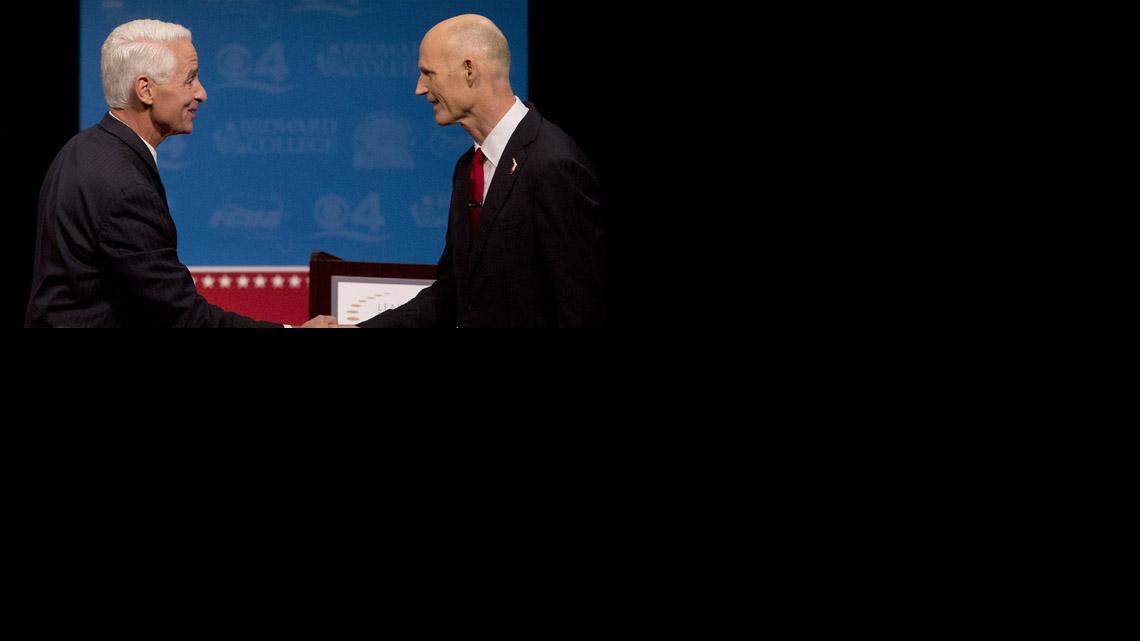 
Charlie Crist, left, and Gov. Rick Scott, shake hands after their second debate.
