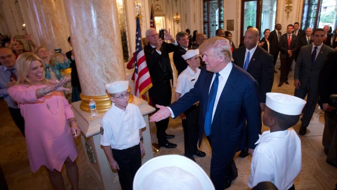 Florida Attorney General Pam Bondi, left, greets Republican presidential candidate Donald Trump as he arrives at the Palm Beach County GOP Lincoln Day Dinner at the Mar-A-Lago Club, March 20, 2016, in Palm Beach.