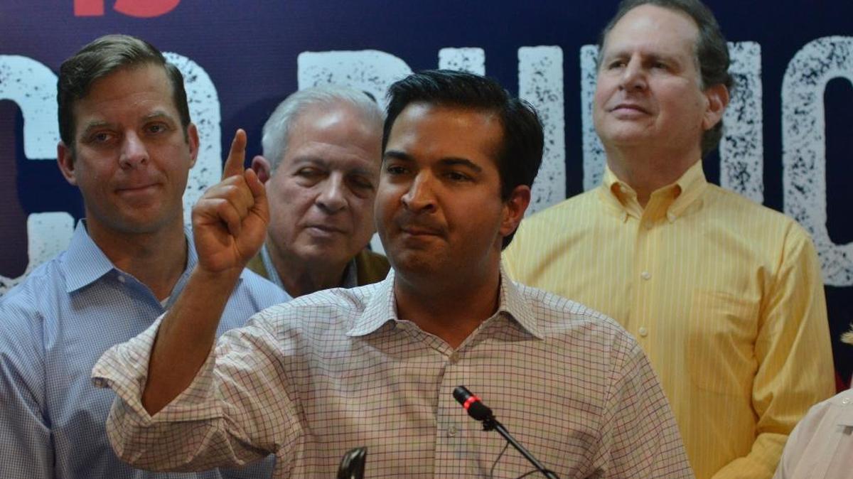 U.S. Rep. Carlos Curbelo emphatically gestures during the opening of the Miami office for Marco Rubio’s presidential campaign. Curbelo faces a tough re-election in November.