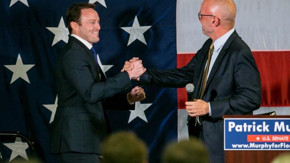 Congressman Patrick Murphy, left, is introduced by Rep. Ted Deutch as Murphy celebrates his Democratic primary win for U.S. Senate at the Doubletree hotel in Palm Beach Gardens on Aug. 30, 2016. Murphy will face Marco Rubio in November.