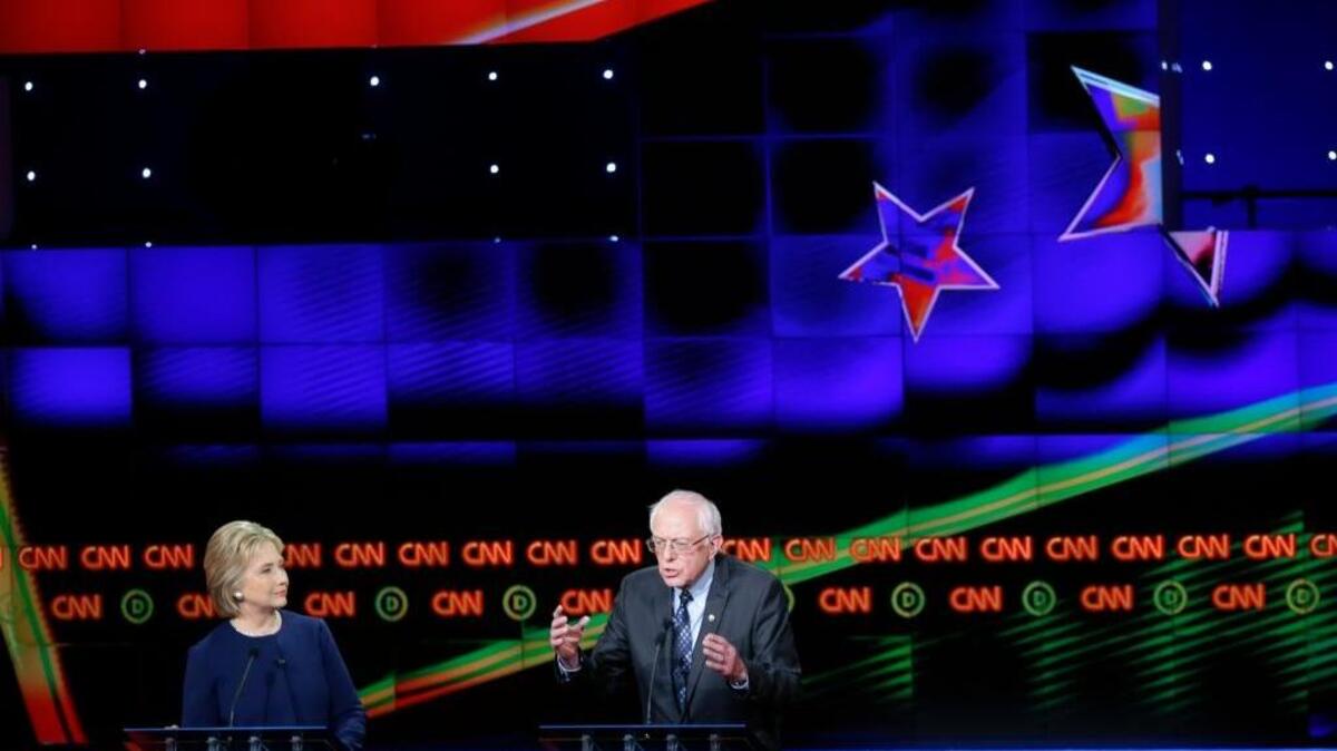 Democratic presidential candidates Hillary Clinton and Bernie Sanders debate in Flint, Mich., on March 6.