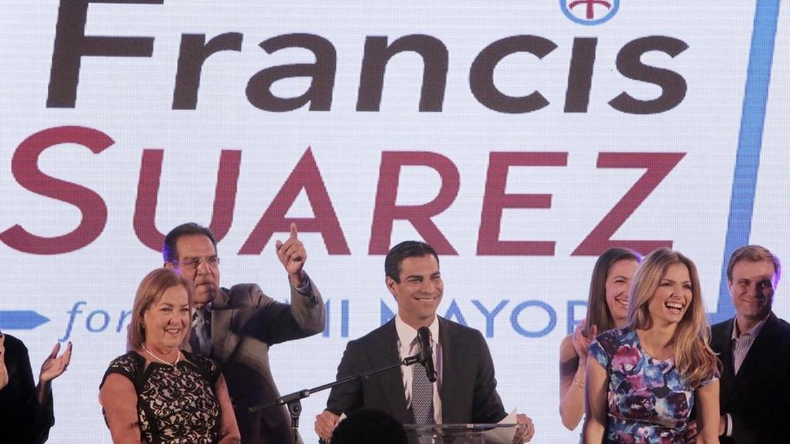 Francis Suarez, center, says he’s not getting involved in the District 3 commission election. But his father, Xavier Suarez (finger in the air), is fighting to keep former Mayor Joe Carollo from returning to office.