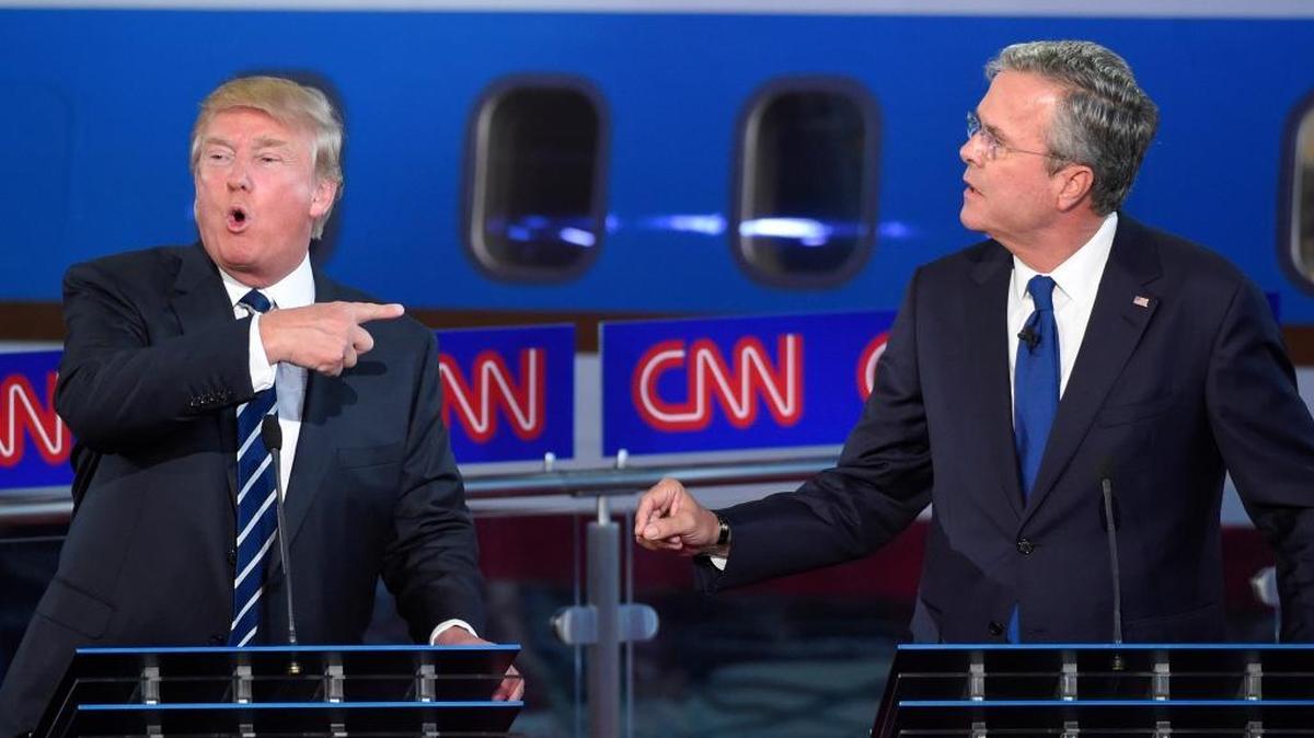 
Republican presidential candidates, former Florida Gov. Jeb Bush, right, and Donald Trump both speak during the CNN Republican presidential debate at the Ronald Reagan Presidential Library and Museum on Wednesday. 
