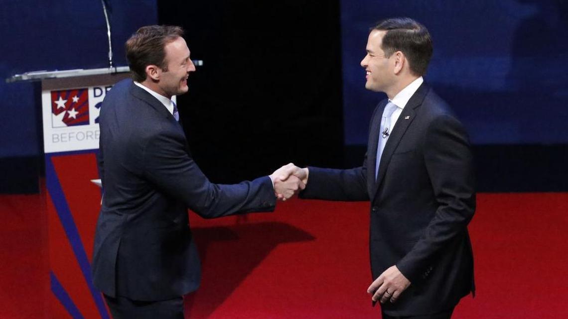 Rep. Patrick Murphy, left, and Sen. Marco Rubio shake hands before the start of a debate, Wednesday, Oct. 26, 2016, at Broward College in Davie, Fla. Rubio and Murphy held their second and final debate, 13 days before the election.