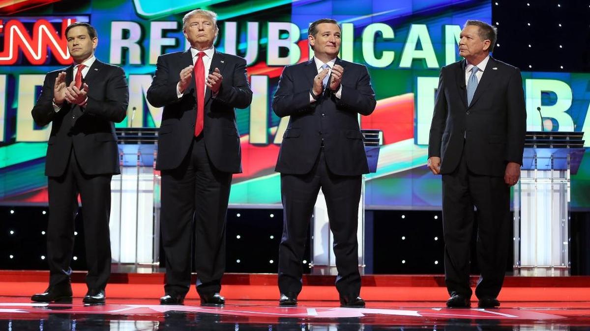 Republican presidential candidates, Sen. Marco Rubio, R-Fla, businessman Donald Trump, Sen. Ted Cruz, R-Texas and Ohio Gov. John Kasich stand for the national anthem during before the Republican presidential debate at the BankUnited Center in Coral Gables on Thursday, March 10, 2016.