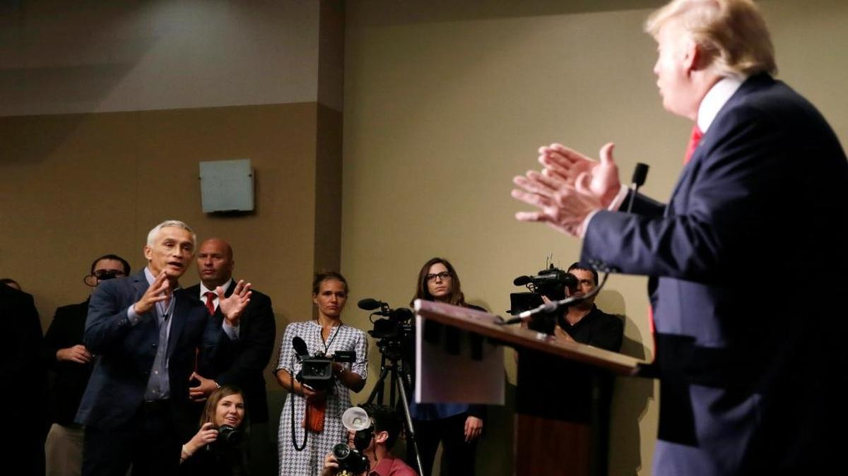 
Univision anchor Jorge Ramos asks Republican presidential candidate Donald Trump a question about his immigration proposal during a news conference in Dubuque, Iowa.
