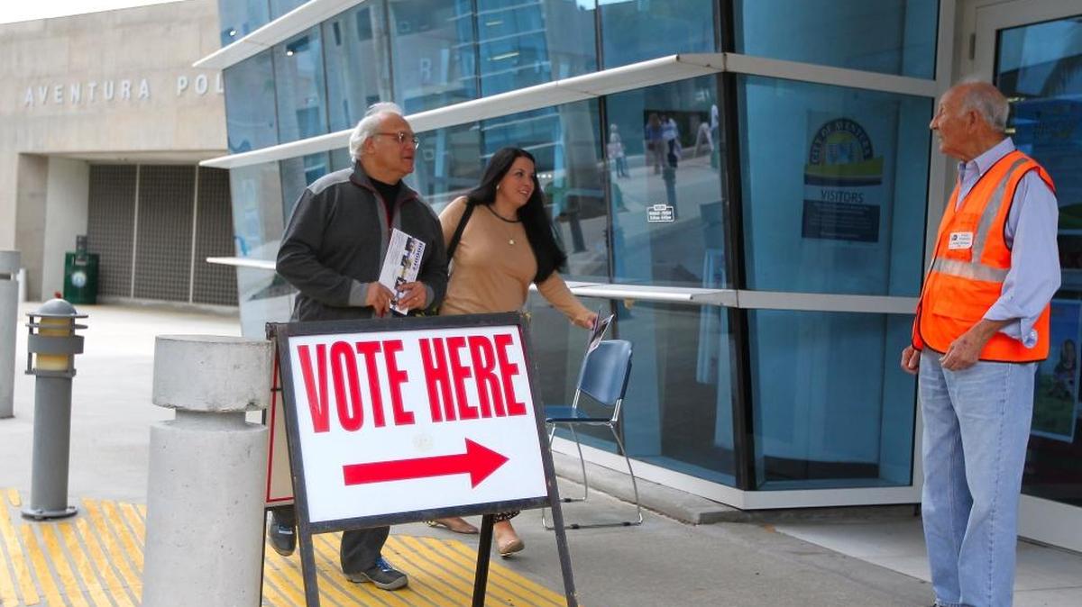 Voters walk into Precinct 109 in the Aventura Government Center during the General Election, November 4, 2014.