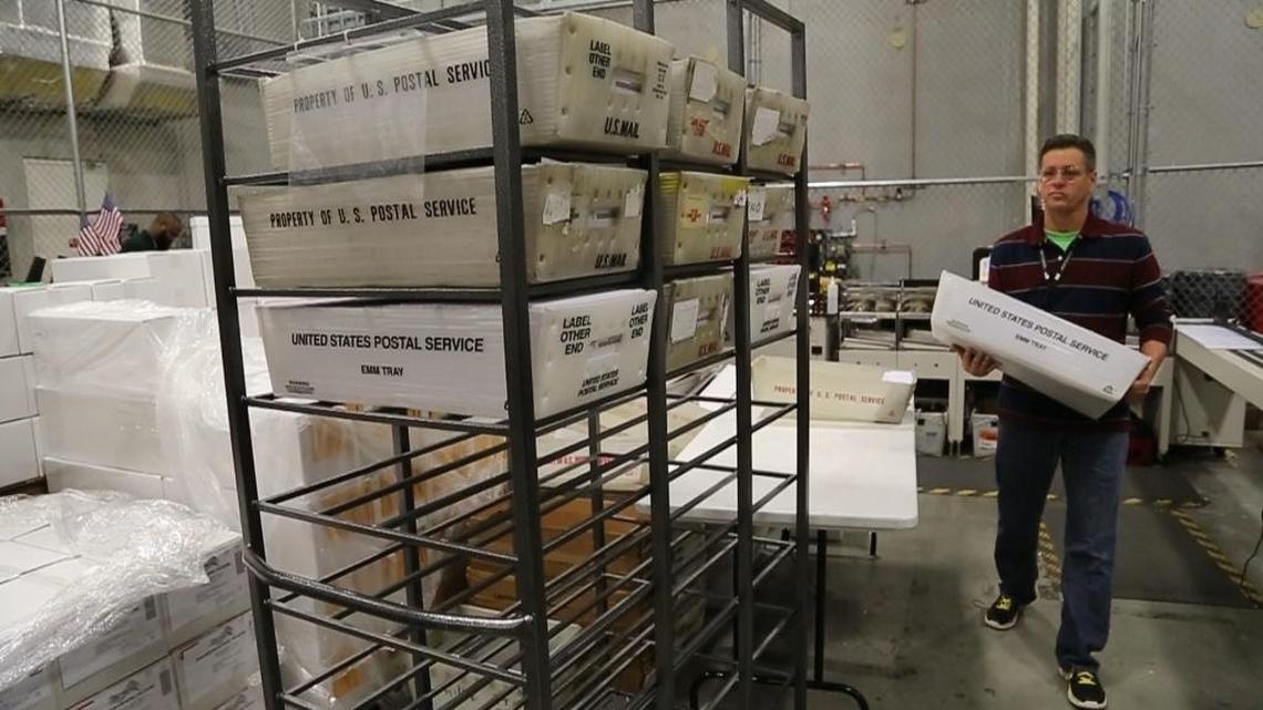 A worker at the Miami-Dade County Elections Department in Doral prepares ballots to be mailed to voters, February 1, 2016.