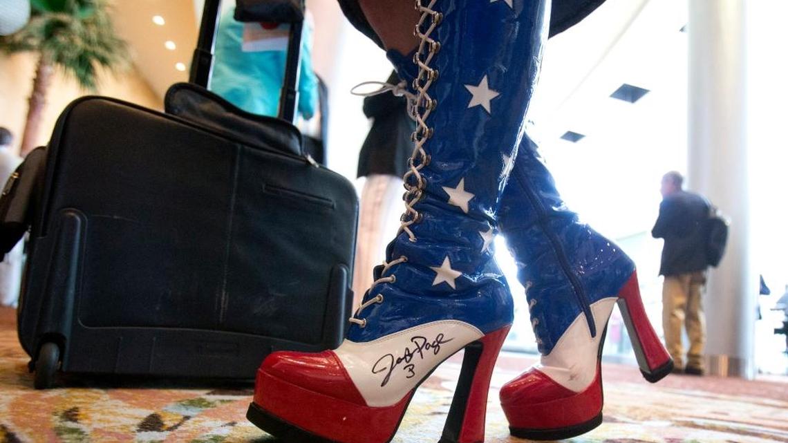 Amy Hedtke, from Waxahachie, Texas, wears patriotic boots at the Republican National Committee spring meeting Thursday in Hollywood, Florida.