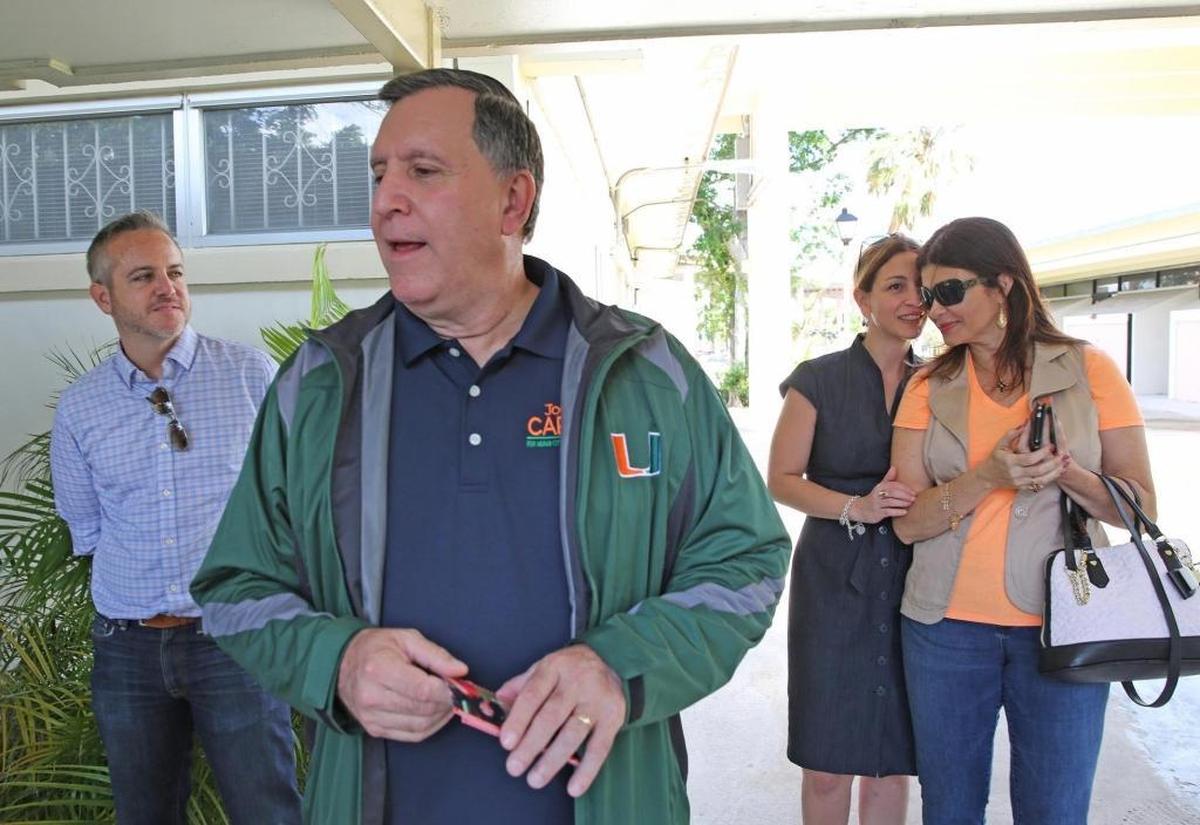 During his 2017 commission campaign, Miami Commissioner Joe Carollo greets supporters at Robert King High Towers surrounded by C. J. Gimenez, left, Tania Gimenez and Marjorie Carollo on Tuesday, Nov. 7, 2017.