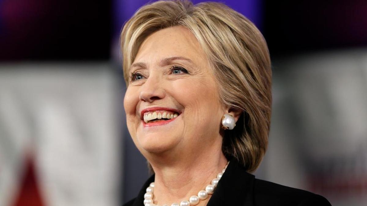 Hillary Clinton smiles as she takes the stage during a Democratic presidential primary debate Saturday in Iowa.
