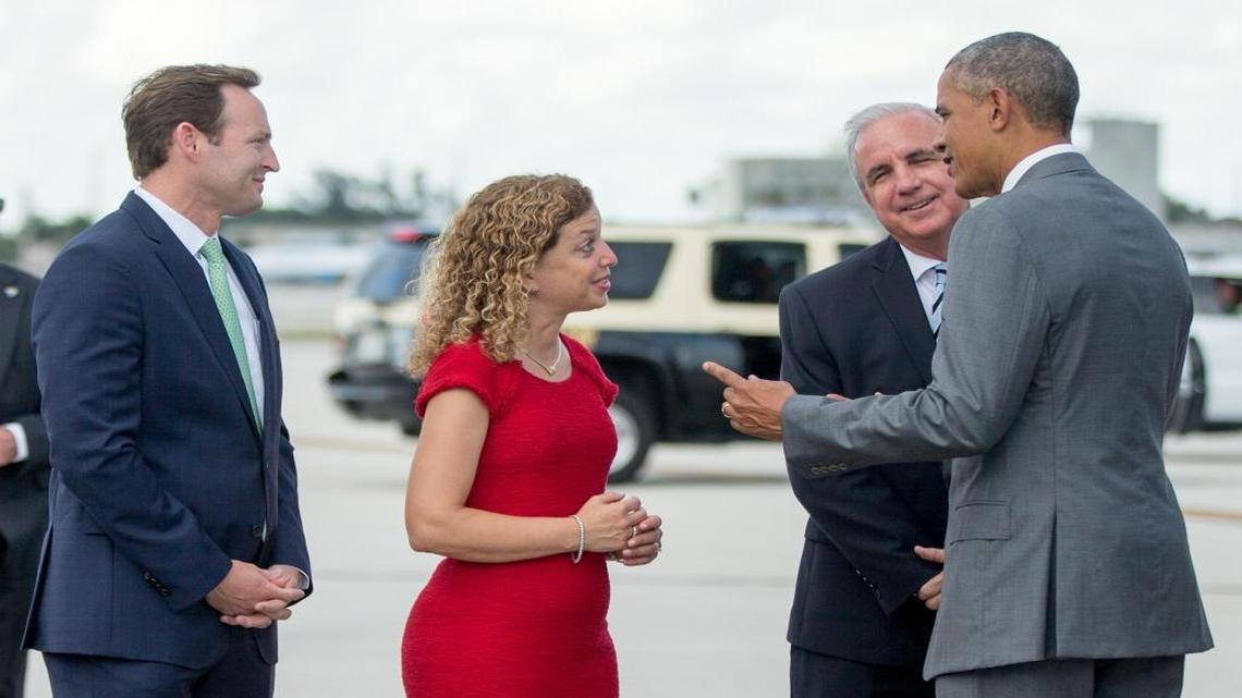 President Barack Obama is greeted by, from left, Rep. Patrick Murphy, D-Jupiter, Democratic National Committee Chairwoman and Rep. Debbie Wasserman Schultz, D-Weston, and Miami-Dade Mayor Carlos Gimenez upon arriving at Miami International Airport on Friday.