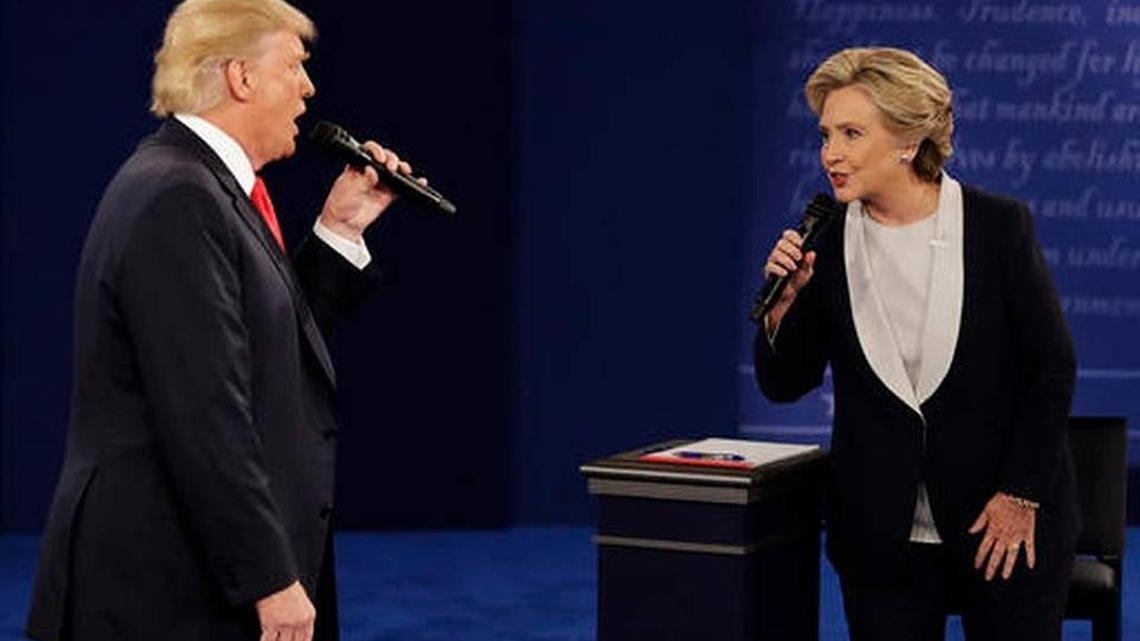 Republican presidential nominee Donald Trump and Democratic presidential nominee Hillary Clinton speak during the second presidential debate at Washington University in St. Louis, Sunday, Oct. 9, 2016.