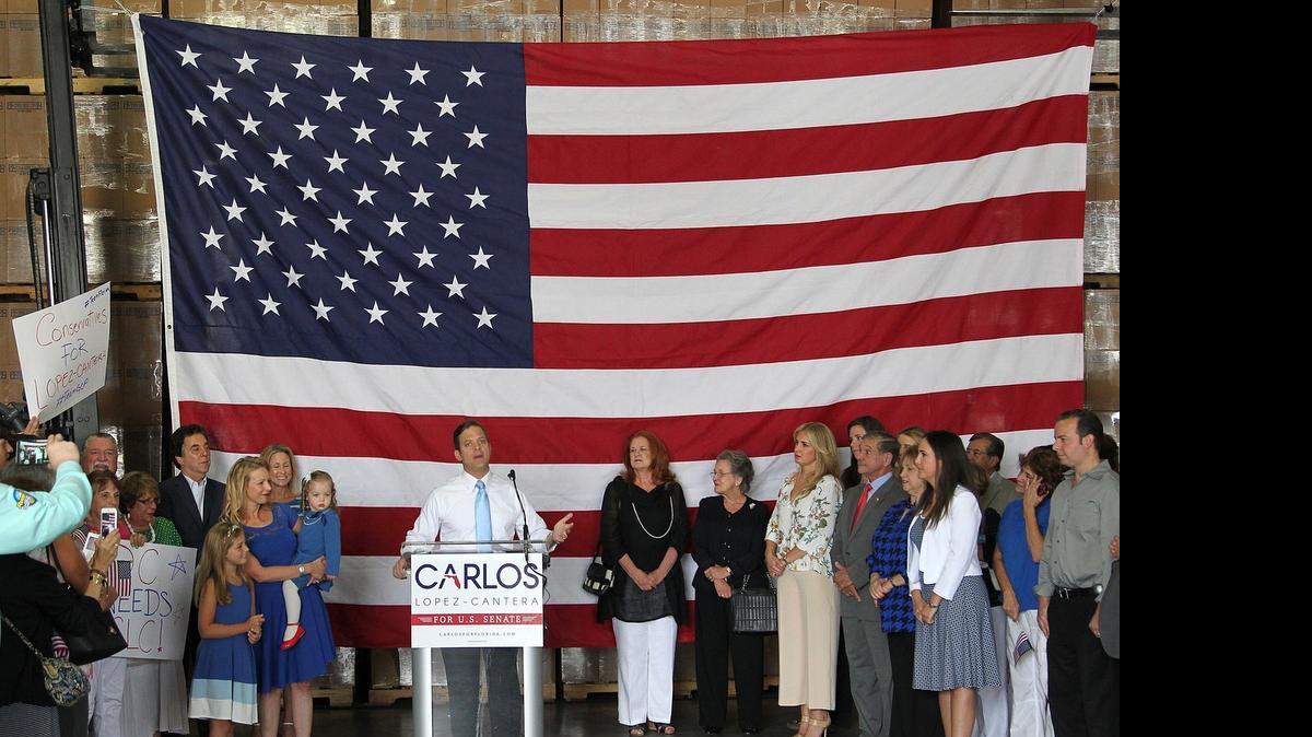 
Florida Lt. Gov. Carlos Lopez-Cantera announces his bid for Marco Rubio’s U.S. Senate seat Wednesday, surrounded by family and friends at a loading dock for a containers manufacturing and wholesale company north of Doral.
