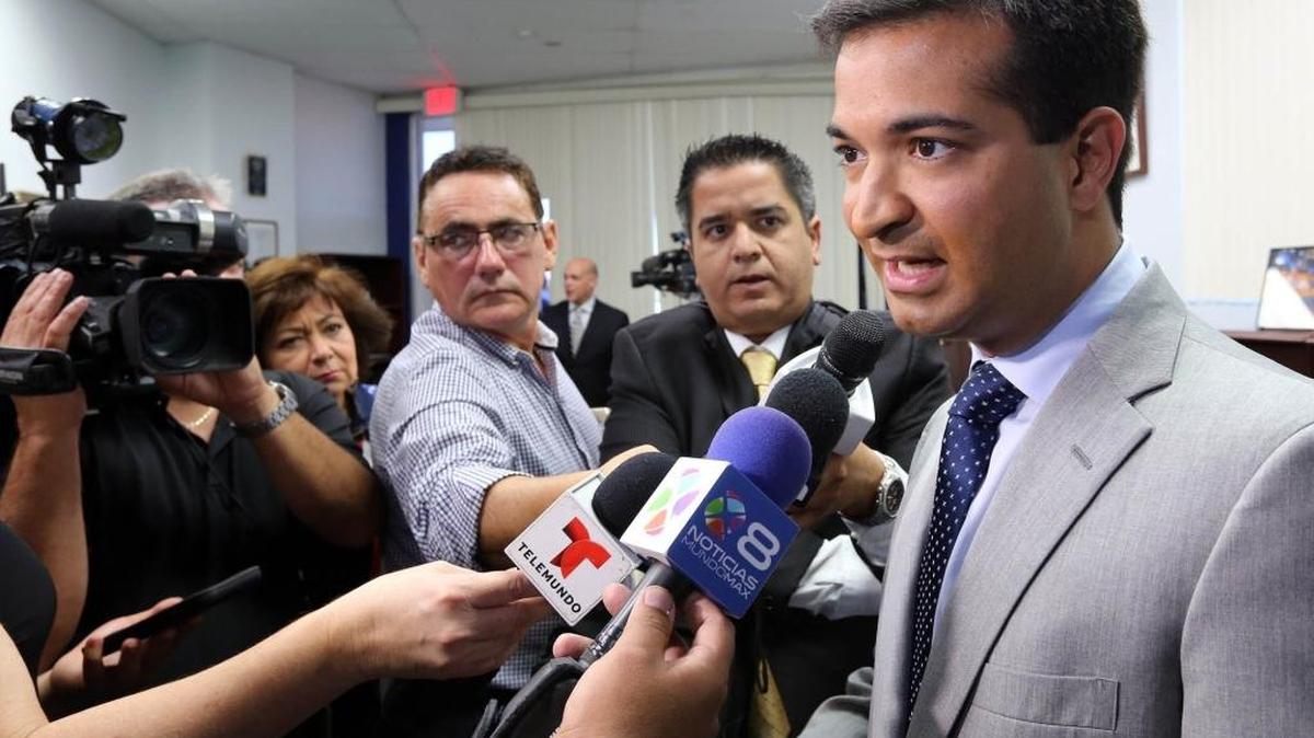 Rep. Carlos Curbelo answers reporters’ questions at a news conference in his office on Oct. 13, 2015.