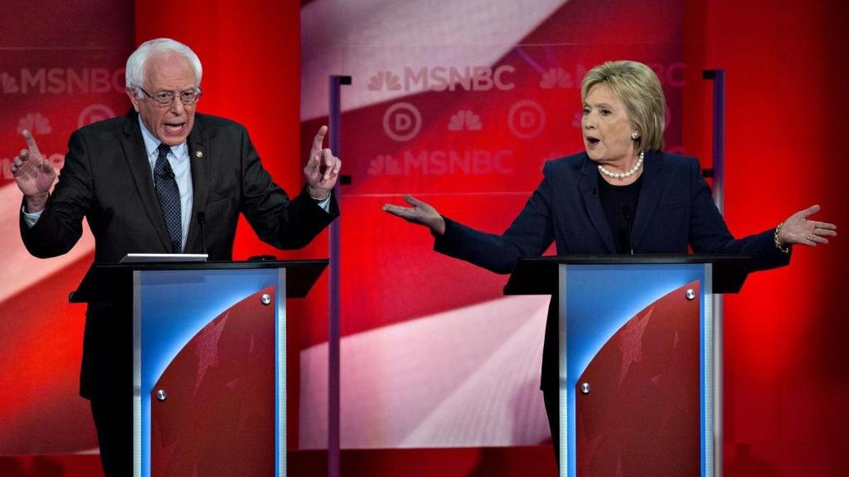 2016 Democratic presidential candidates Hillary Clinton, former Secretary of State, right, and Sen. Bernie Sanders, an independent from Vermont, speak during the Democratic presidential candidate debate at the University of New Hampshire in Durham, N.H., on Thursday, Feb. 4, 2016. Clinton and Sanders each tried to establish their credentials as progressives as they vied for the votes of Democrats and independents in next week's New Hampshire primary.