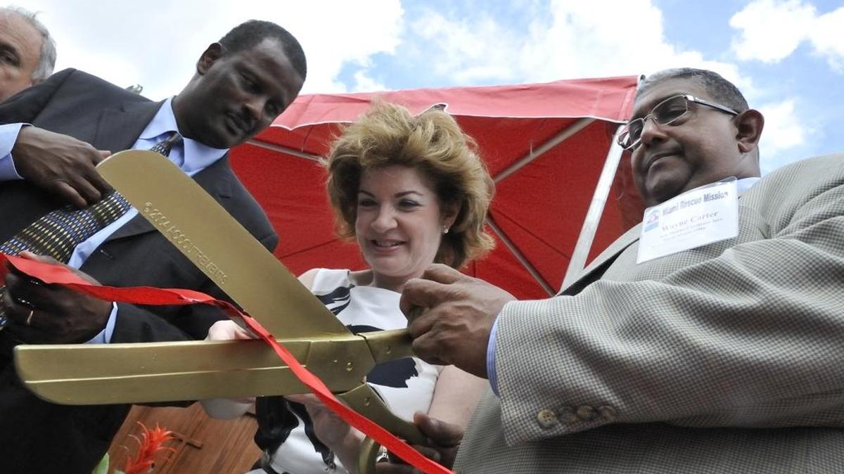 Then-state Rep. James Bush III, left, is shown at the opening of a new health clinic in 2009.