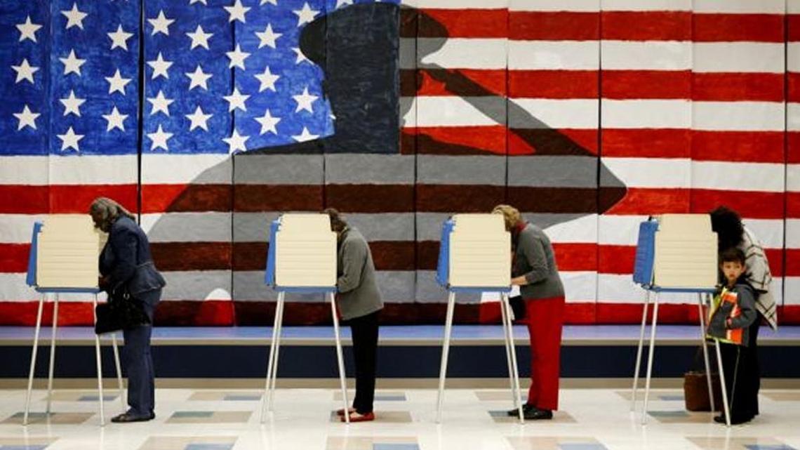 Voters line up in booths to cast their ballots in Chesterfield, Virginia, on Nov. 8.