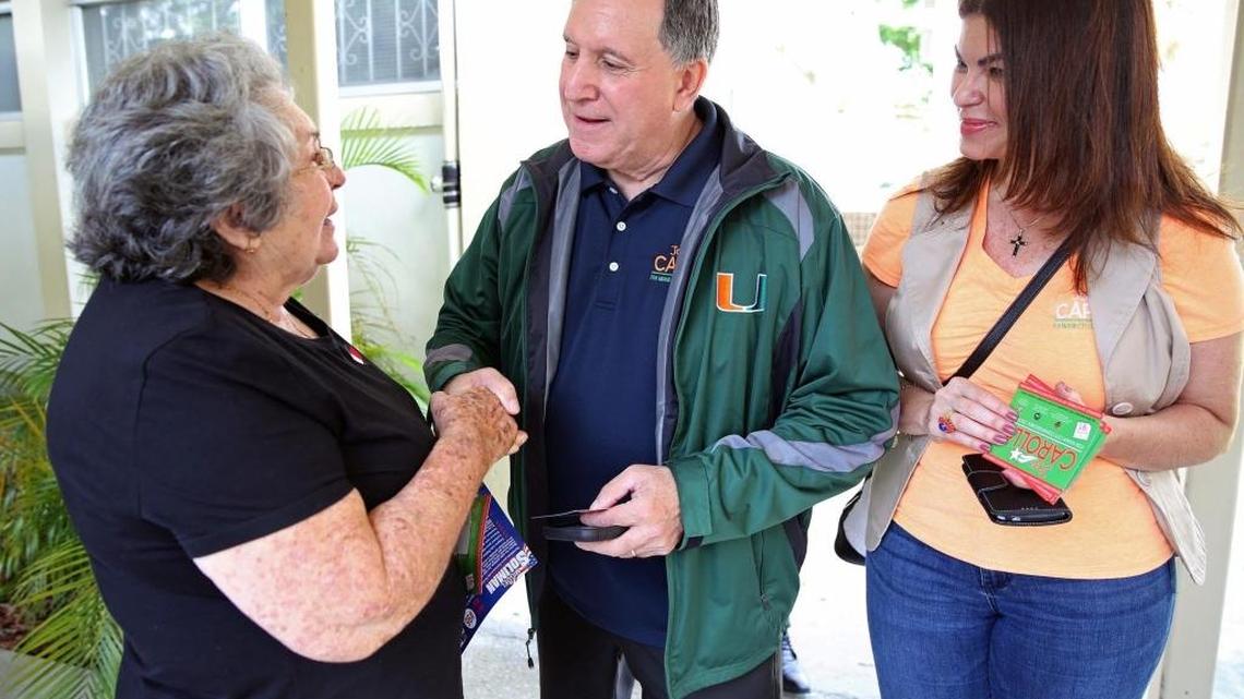 Joe Carollo and his wife Marjorie, right, greets a supporter at Robert King High Tower in Miami on Tuesday, November 7, 2017. Carollo will be in a runoff for the District 3 seat.